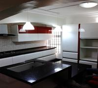 White high gloss kitchen with strips of veneer finishing